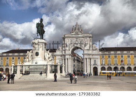 LISBON, PORTUGAL - FEBRUARY 15 2014: People walking on Praca Comercio square in Lisbon, Portugal