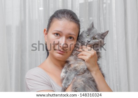women with a cat indoors