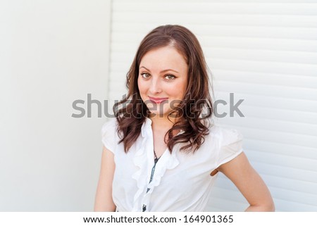 brunette with smiling expression on her pretty face, indoor