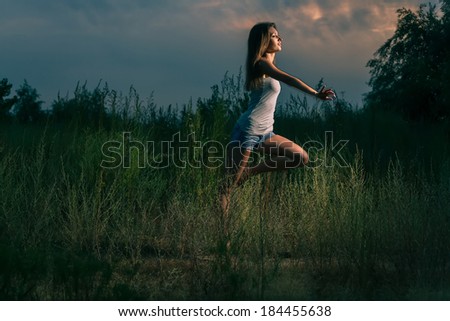 Sexy girl dance in a nature colorized image
