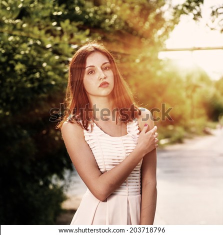 Summer girl portrait. Russian woman on sunny summer or spring day outside in park. Pretty   Caucasian young woman outdoors.