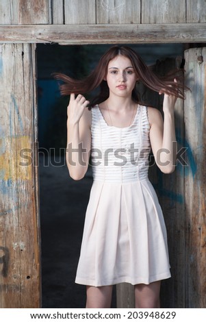 Young women in slums with her hair fly in the air.