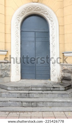 Ancient door painted in dark blue color