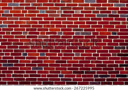 Deep red wall. Background of red brick wall pattern texture backdrop wallpaper. Perfect texture for your design. American style masonry brickwork. Urban backdrop. Wall of modern buiding.