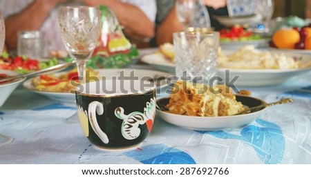 Traditional russian dinner. Tea,cake,fryed meet,vegetables salads