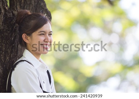 Asian student in park of Bangkok Thailand