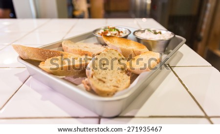spread bake bread in tray on table in kitchen