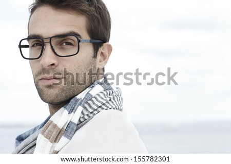 Portrait of mid adult man wearing scarf and spectacles