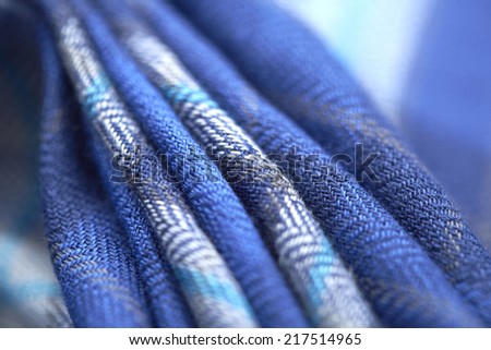 Close up of blue checked material in a row