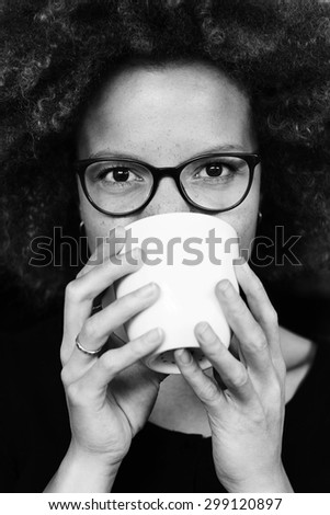 Young woman drinking coffee,  portrait
