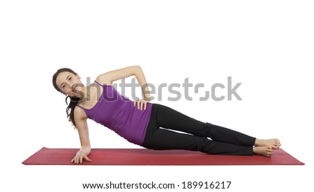 Young woman working out her side body.