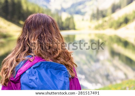 Hiker woman outdoors watching landscape