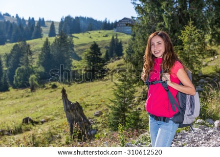 Attractive hiker woman in nature in soft sun light