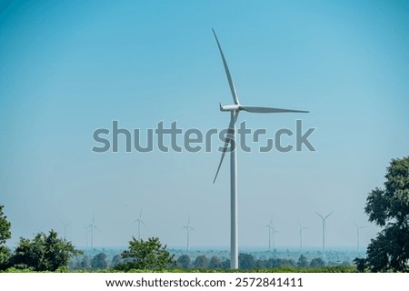 Similar – Image, Stock Photo Wind turbine with rising sun