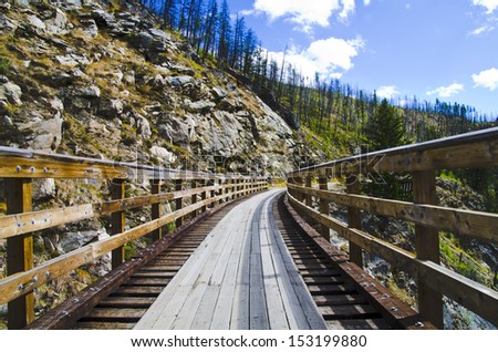 Historic Trestle Bridge. Myra Canyon in British Columbia, Myra Canyon is a popular tourist attraction featuring a cycling and hiking trail following the historical route of the Kettle Valley Railway.