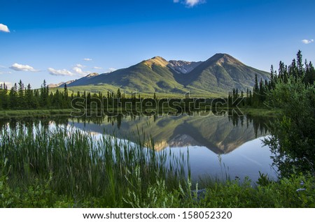 Mountain Landscape in Banff National Park Canadian Rockies. Sulphur Mountain Reflected in Vermillion Lakes in the Evening.