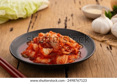 Similar – Image, Stock Photo Kimchi, fermented chinese cabbage in hot chili sauce , in bowl with chopsticks on rustic kitchen table. Close up