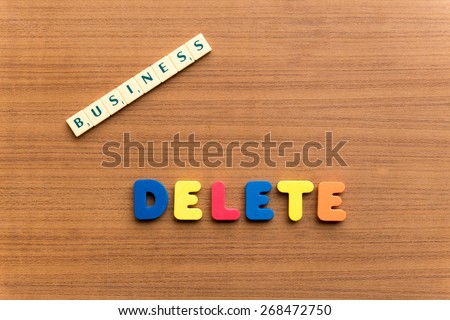 delete colorful word on the wooden background
