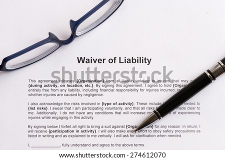 waiver of liability  on the white paper with pen
