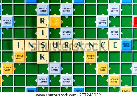 March 3, 2015 - Dhaka, Bangladesh - illustrative editorial of Scrabble tiles spelling risk insurance