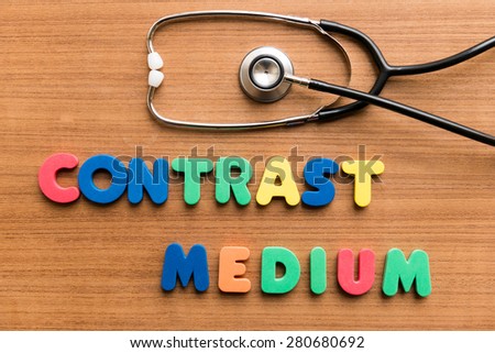 Contrast medium   colorful word with Stethoscope on wooden background