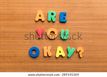 are you okay  colorful words on the wooden background