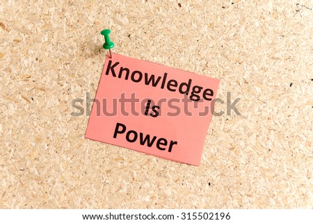 knowledge is power word typed on a paper and pinned to a cork notice board