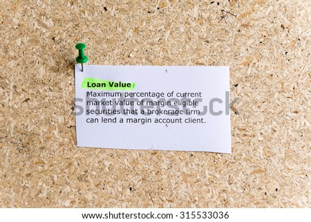 loan value word typed on a paper and pinned to a cork notice board
