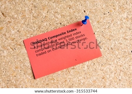 nasdaq composite index word typed on a paper and pinned to a cork notice board