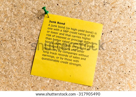 junk bond word typed on a paper and pinned to a cork notice board