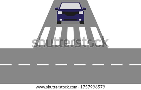 Blue car at a crossroads in front of a pedestrian crossing