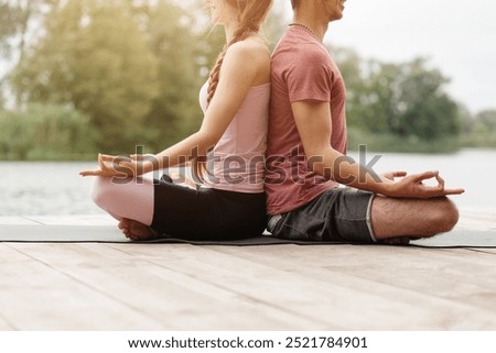 Similar – Image, Stock Photo Calm couple meditating together on mat at home