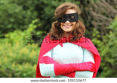 Young woman with red super heroes kit smiling