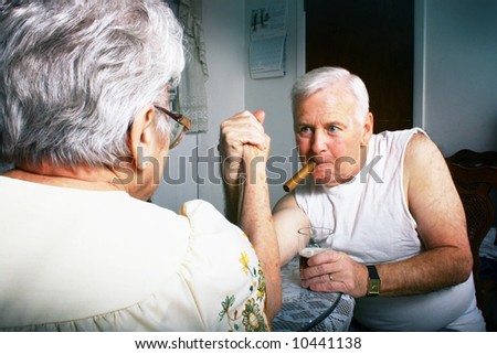 elderly couple Arm wrestling