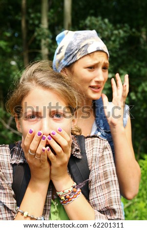 Two young teenagers looking scary in a forest