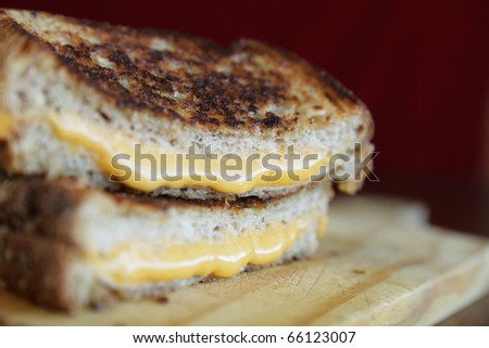 Close up of a grilled cheese with melted cheese