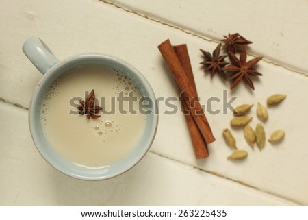 Top view of a chai tea with cinnamon, anise and cardamom