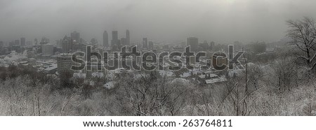 Panorama of downtown Montreal during winter snowstorm from the mont royal mountain.