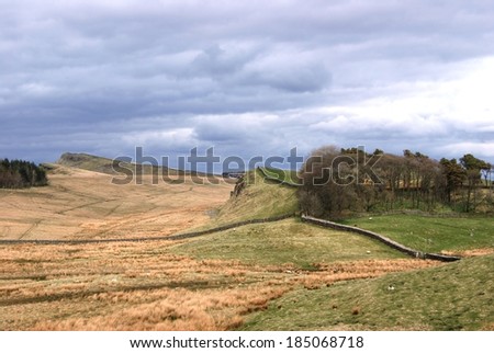 Hadrian\'s Wall as seen from the Roman Fortress at Housesteads with beautiful landscape and weather