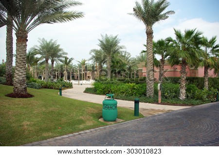 Recreation Park on the shores of the Persian Gulf in Dubai. Lawns, paths, artificial lakes and rivers, trees and shrubs - all created by man on the bare sand.