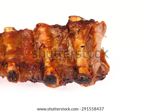 juicy barbecued pork ribs on a white background