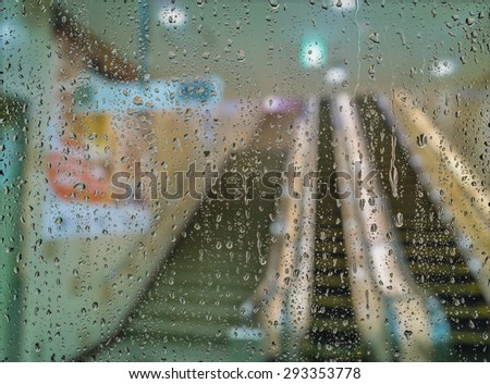 blurred image of escalator in rain background.