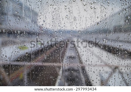 Rain drops on the window. A view of The train tracks.