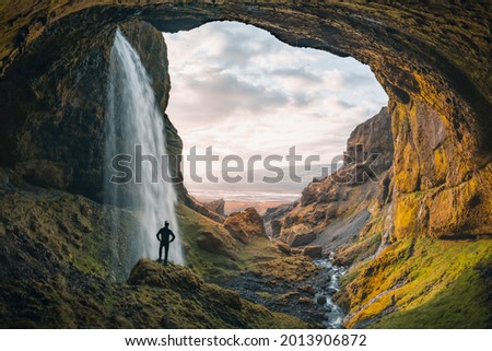 Similar – Image, Stock Photo Man standing in volcanic valley during trip
