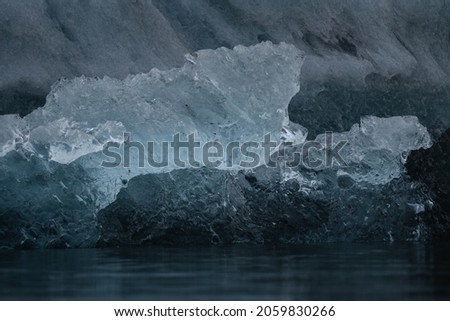 Icebergs floating. Ices and icebergs. Glacier lagoon. Greenland iceberg. Melting ice. South coast Iceland. Jokullsarlon glacier lagoon. Volcanic ash on the ice. Ice age glacier. Melting iceberg