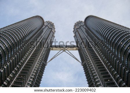 KUALA LUMPUR, MALAYSIA - JANUARY 3 2014: The Petronas twin towers are twin skyscrapers in Kuala Lumpur, the tallest twin towers in the world and the tallest buildings in the world from 1998 to 2004.