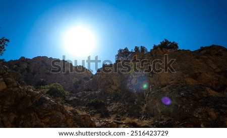 Similar – Foto Bild Felsen mit steilen Hängen in gebirgigem Terrain