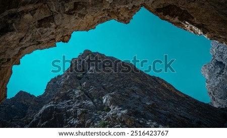 Similar – Foto Bild Felsen mit steilen Hängen in gebirgigem Terrain