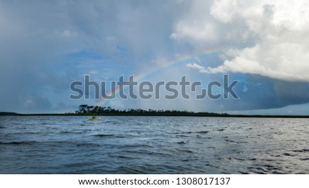 Similar – Image, Stock Photo Rainbow over a paddling pool in a garden