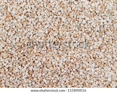 Barley grits for background and texture. Barley cereal. Top view.